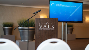 Meeting with TV screen and lectern
