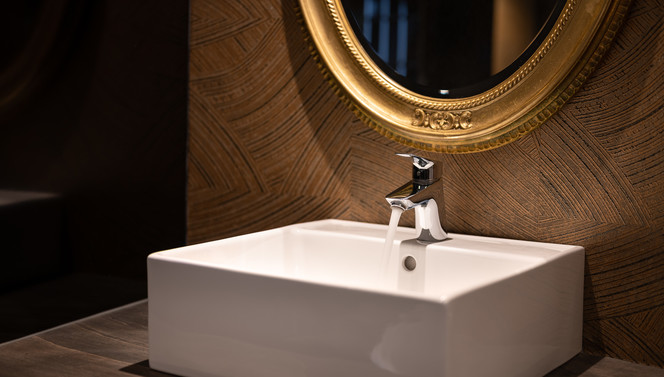 sink with gold mirror